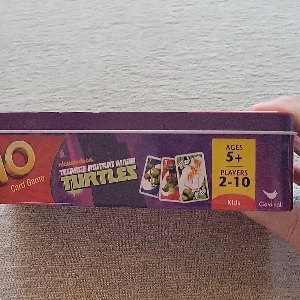 Uno Teenage Mutant Ninja Turles card game in storage tin.  Great condition.